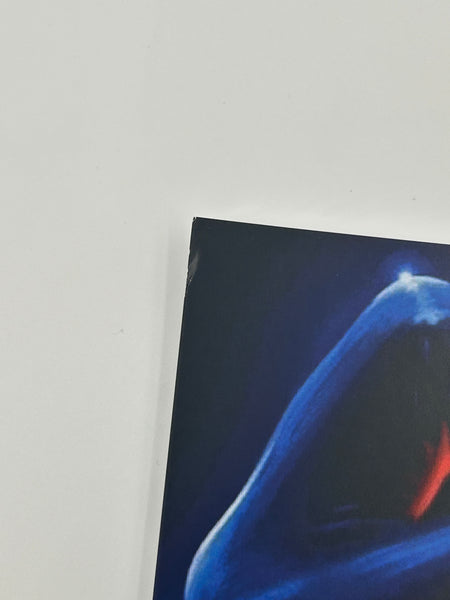 Small dent on top left corner.